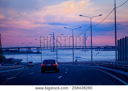 Whsd Bridge In St. Petersburg In The Evening At Sunset. High-speed Bypass Toll Road. Petersburg Brid