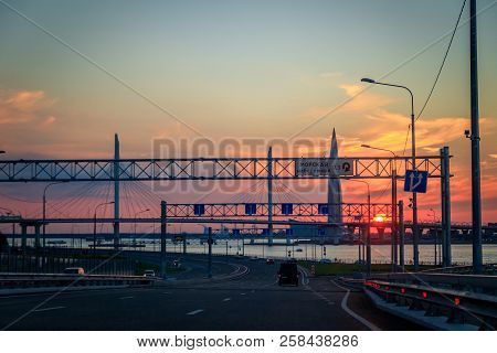 Whsd Bridge In St. Petersburg In The Evening At Sunset. High-speed Bypass Toll Road. Petersburg Brid