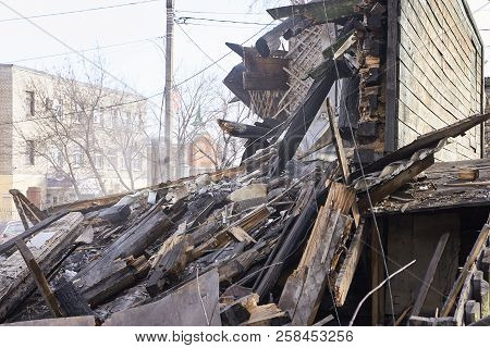 Demolition House Using Excavator In City. Rebuilding Process. Remove Equipment