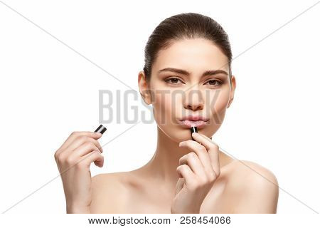 Girl Applying Pink Lipstick Isolated On White