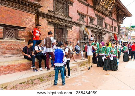 Group Of Dancers Wearing Traditional Costumes In Patan Durbar Square, Kathmandu Valley, Nepal
