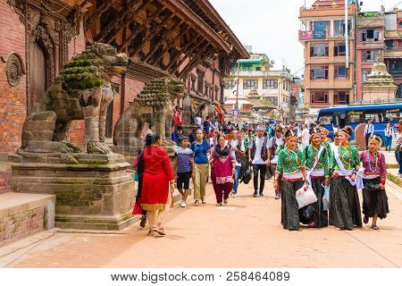 Group Of Dancers Wearing Traditional Costumes In Patan Durbar Square, Kathmandu Valley, Nepal