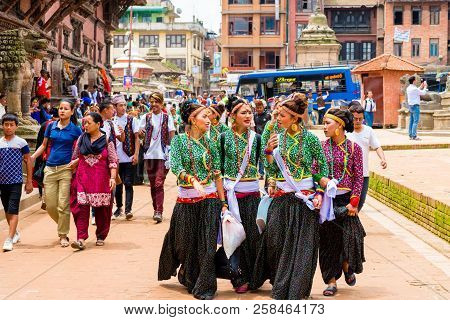 Group Of Dancers Wearing Traditional Costumes In Patan Durbar Square, Kathmandu Valley, Nepal