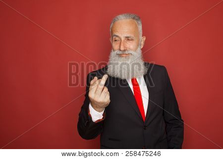 Old Bearded Businessman Showing Fuck Sign At Camera And Smiling. Business People Concept, Richly And