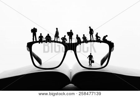 Miniature People Making A Break On Glasses