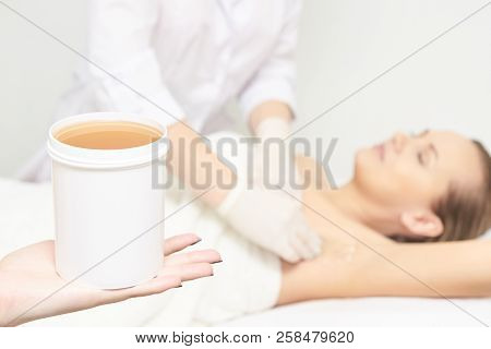 Sugar Hair Removal From Woman Body. Wax Epilation Spa Procedure. Procedure Beautician Female. Armpit