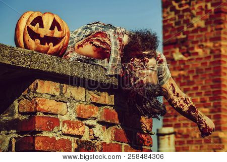 Bearded Zombie Man With Beard Vampire Or Bloody War Soldier With Wounds And Red Blood With Halloween