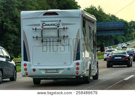 Grafschaft; Germany - August 13; 2017:
Motorhome On The A 61 Motorway In Tourist Traffic Near The Ci