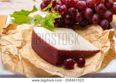 Traditional Spanish Cheese, Murcian Wine Cheese From Goat Milk With Rind Washed In Red Wine, Served