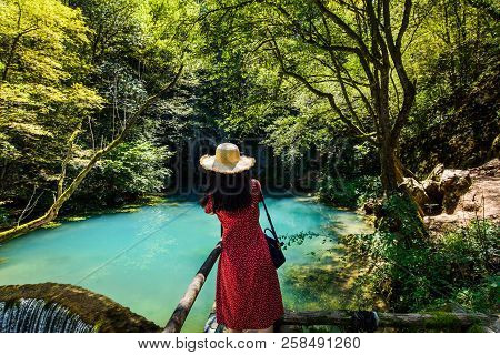 Girl Enjoying Day Outdoors At A Natural Water Well
