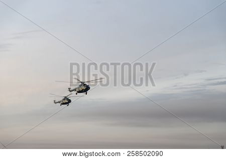 Military Helicopter Mi-8 In The Cloudy Sky