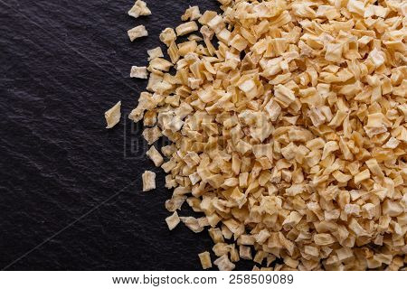 Fragrant Dried Parsnip On A Dark Stone Background