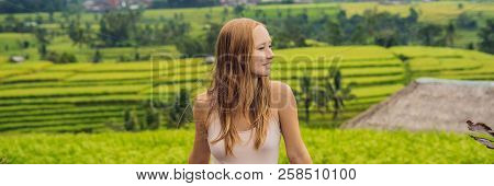 Young Woman Traveler On Beautiful Jatiluwih Rice Terraces Against The Background Of Famous Volcanoes