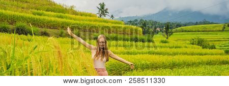 Young Woman Traveler On Beautiful Jatiluwih Rice Terraces Against The Background Of Famous Volcanoes