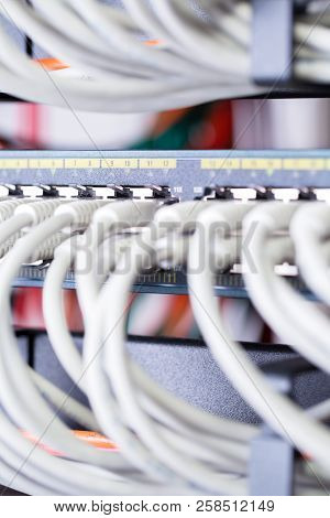 Close-up Of Gigabit Network Switch And Cables In Datacenter