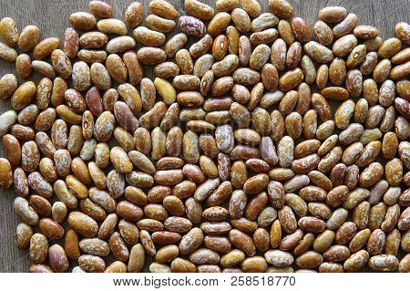Pinto Beans Background. Orange Dried Pinto Beans Texture.