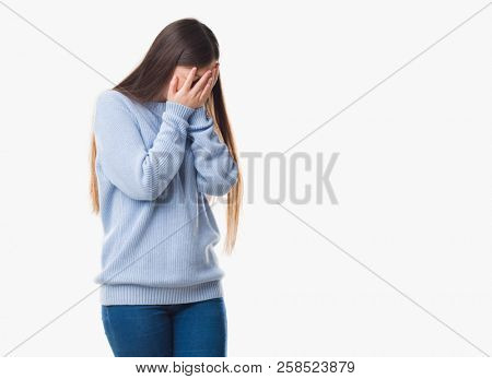 Young Chinese woman over isolated background with sad expression covering face with hands while crying. Depression concept.