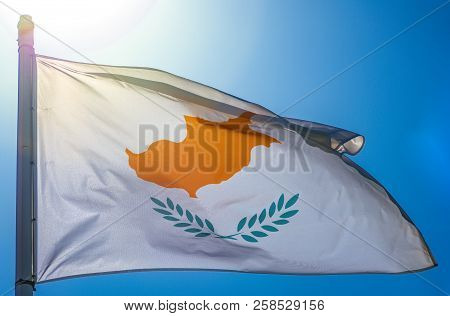 Flag Of Cyprus. Cyprus Flag On Flagpole Against The Blue Sky