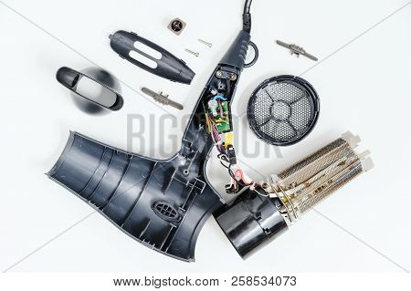 Hairdryer In A Disassembled Condition On A White Background.