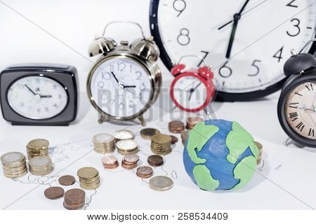 A Lot Of Coins On World Map. Abstract Photo Of World Economy