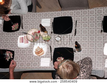 Overhead Shot Of People Eating And Drinking Together At The Dibber Table
