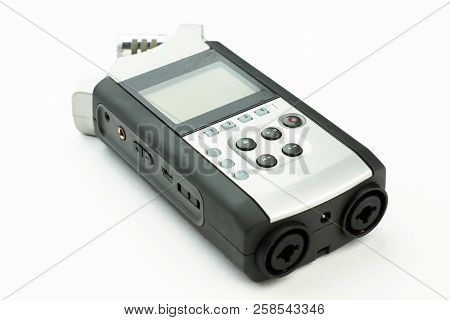 Dictation Machine On White Background. Digital Voice Recorder. Portable Device For Sound Recording.