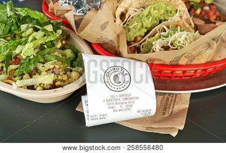 Miami, Usa - August 22, 2018: Chipotle Plate And Receipt. Chipotle Restaurant Logo. Chipotle Mexican