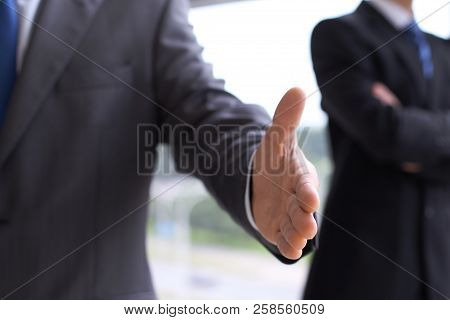 Unknown Business Man Offering Handshake While Standing Straight. Success Cooperation And Agreement C