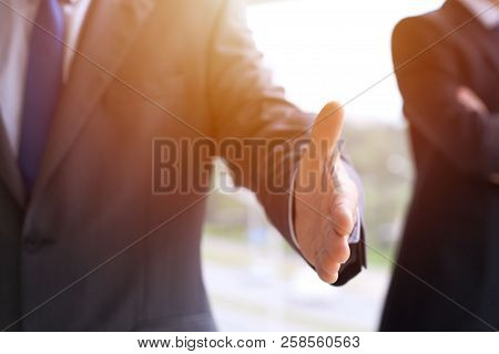 Unknown Business Man Offering Handshake While Standing Straight. Success Cooperation And Agreement C