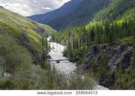 Oroi Bridge On The Chuya River.  End Of The Mazhoy Cascade. August. Surroundings Of The Village Of C