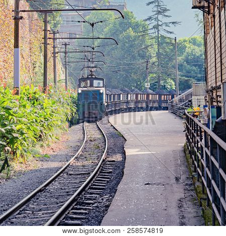 Narrow-gauge Locomotive With The Freight Train Moves From Yuejin To Shixi. Jiayang Mining Region. Si