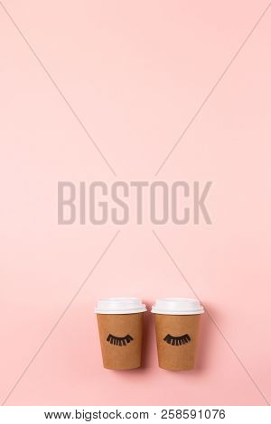 Two Craft Cups To Do On The Pastel Pink Background. Decorated With Funny Cute Paper Eyes. Wake Up An