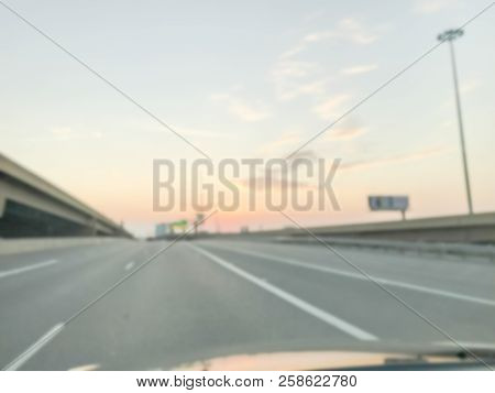 Blurry Background Highway Interstate With Elevated Road Viaducts At Sunrise In Usa