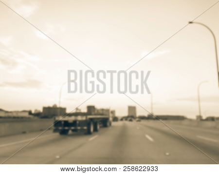 Blurry Background Long Vehicles Commute On Interstate Highway At Sunrise