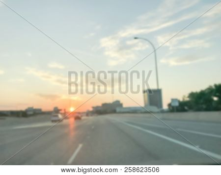 Blurry Background Usual Traffic Condition On Highway Interstate At Sunrise In Usa