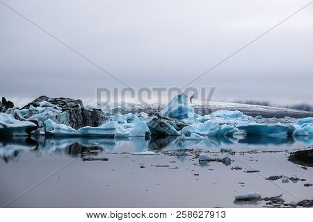 Iceland,icebergs At Jökullsárlón Glacier Lagoon, On A Misty Summer Evening