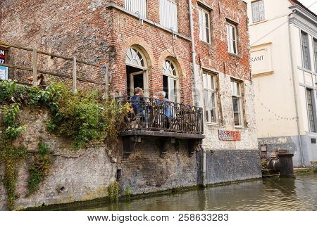 Ghent, Belgium - August 14, 2015 - Old Women Friends On The Balcony In The Historical Medieval City.