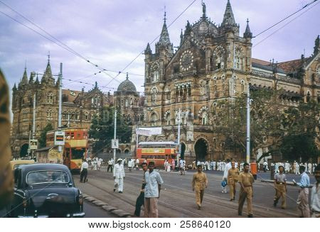 Bombay, India - Circa 1962: Vintage Photo Of Busy Street In Front Of Victoria Terminus Railway Build