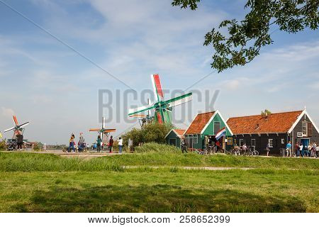 Zaanse Schans, Netherlands, August 19, 2015 - Traditional, Authentic Dutch Windmills At The River Za