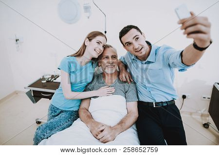 Selfie With Happy Family In Clinic. Young Man Selfie In Hospital. Young Girl Selfie In Clinic. Happy