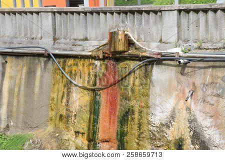 Sairme Mineral Water Spring In Caucasus Mountains. Colored Formations Mineral Water