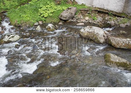 Beautiful Place At Source Of The River In The Mountains Of Southern Caucasus. Mountains River