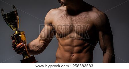 Champion's Cup, Man's Is Holding Gold Cup. Winner Strong Man, Sport, Professional Champion. Muscular