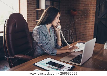 Intelligent Brunette Lady In Loft Workplace Dials A Phone Number To Contact The With The Department 