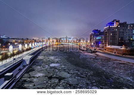 View Of Moscow Kremlin And Bolshoy Kamenny Bridge From Patriarshy Bridge At Night In Winter In Mosco