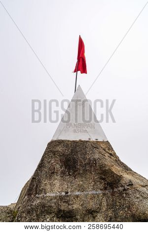 Peak Of Fansipan And Flag In The Clouds On Sapa Vietnam. Top Spot In Indochina Altitude 3,143m Landm