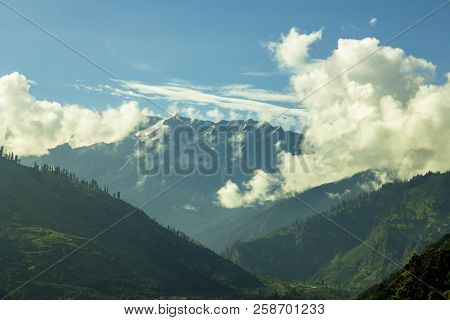 Mountain Snow Foggy Valley With Low Clouds