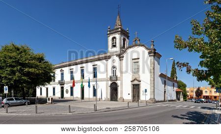 Vila Nova de Famalicao, Portugal - September 06, 2017: Lapa Chapel - a Sacred Art Museum (right), and the Lusiada University branch (left)