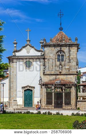 Braga, Portugal - July 27, 2015: Sao Joao do Souto Church (left) and Coimbras Chapel (right). Medieval religious architecture.
