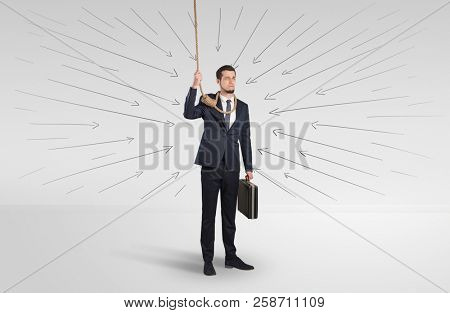 Hopeless young businessman trying to suicide with question signs concept